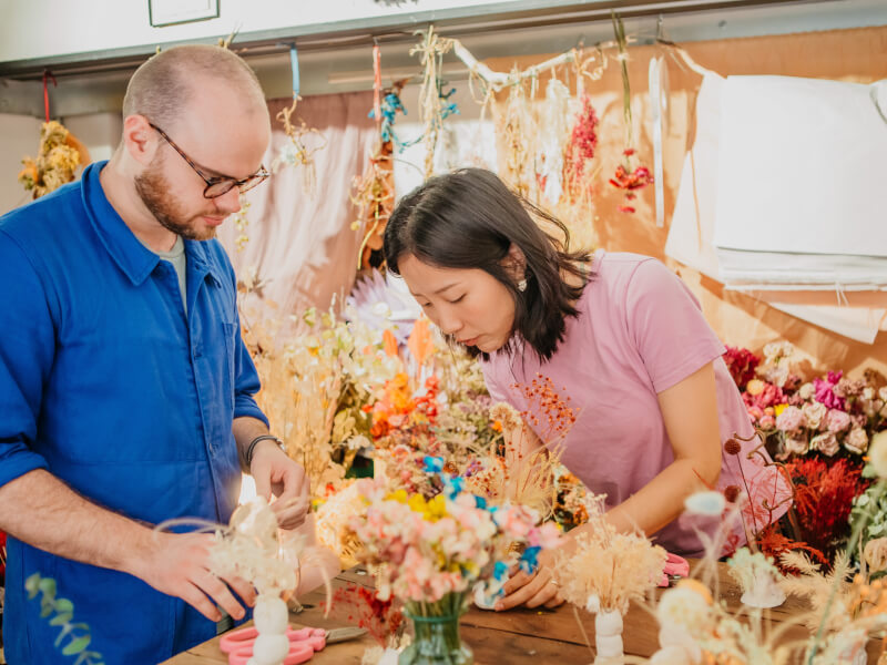 Man and woman in a flower arranging class